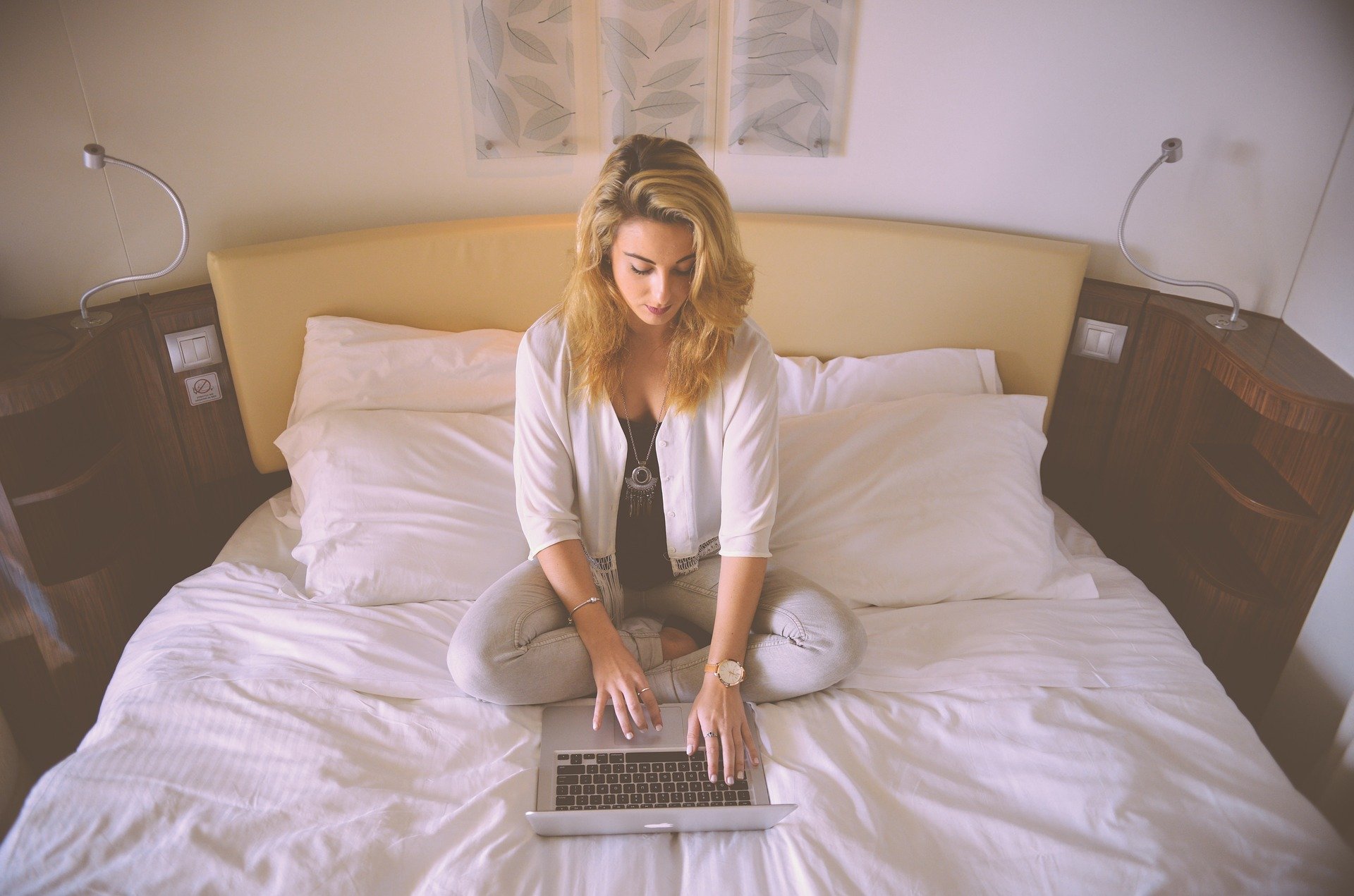 woman working on bed